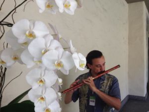 Photo of the composer perfomring on the dizi